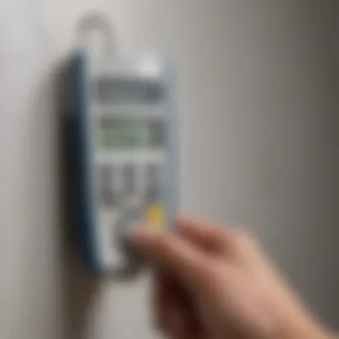 Close-up of a moisture meter in action on drywall